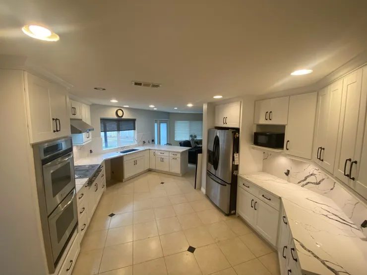 Kitchen remodel with white cabinets and quartz countertops in Norco